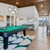 Community area with pool table. 